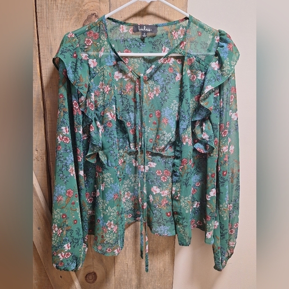 A Lulu's long sleeve sheer button-down floral top with ruffled sleeves in small. - Picture 2 of 7
